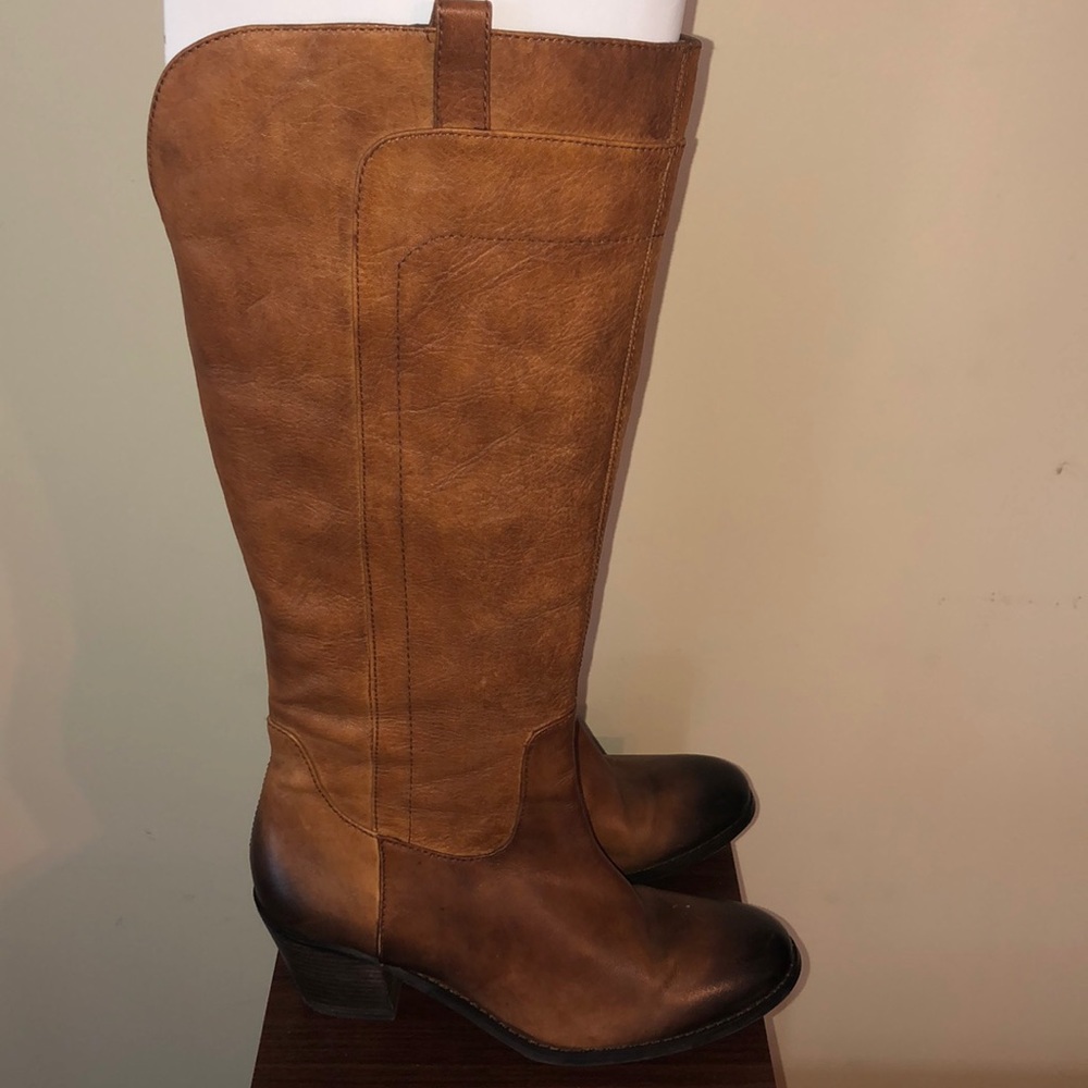 Tan/brown knee high boots.